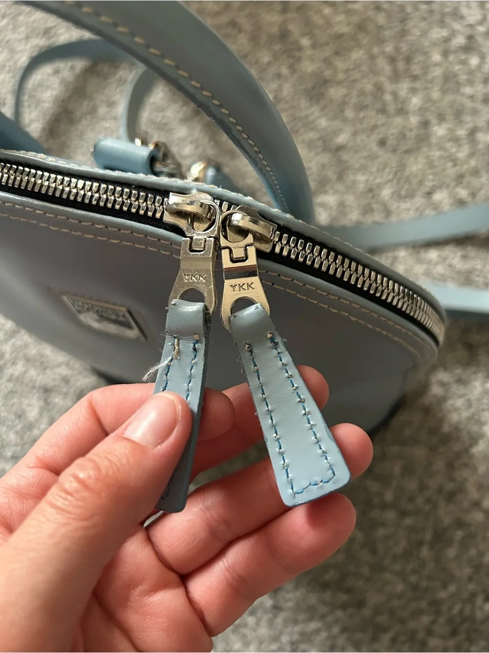 Dooney & Bourke “Pod Backpack” light blue
